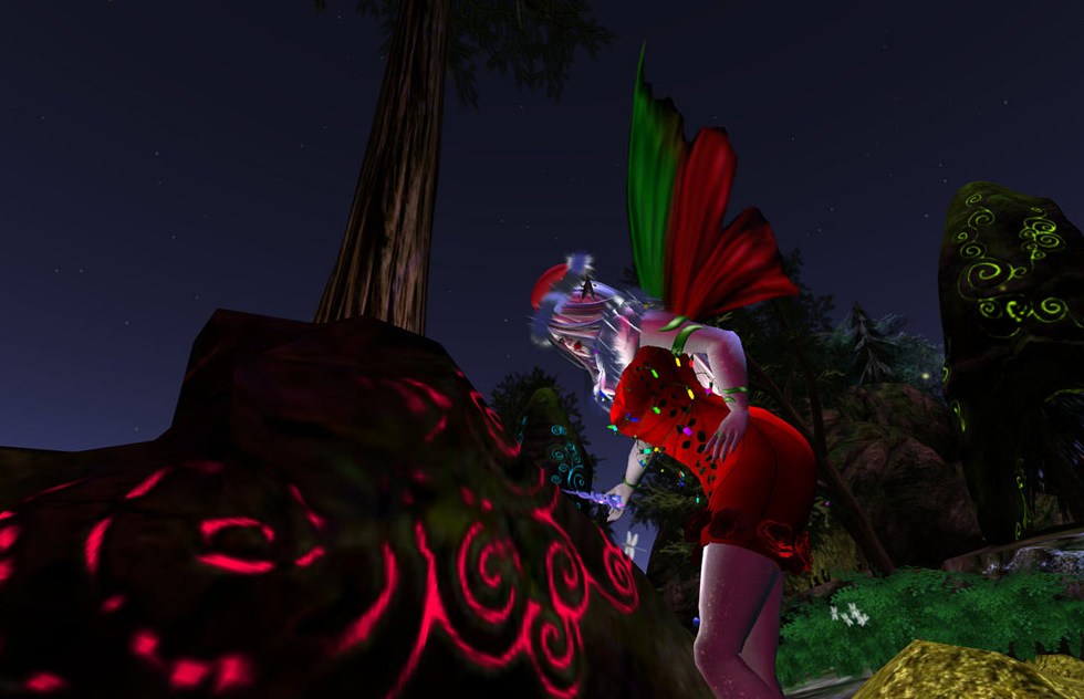 Faery inscribing runes on rock in Second Life