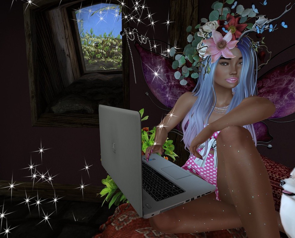 Faerie sits with laptop, ordering cool stuff from the Goddess Whispers shop on Zazzle!